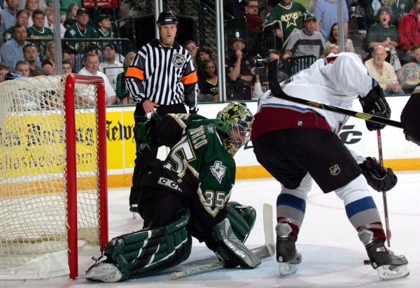 DALLAS - APRIL 30: Andrew Brunette #15 of the Colorado Avalanche scores the game winning goal against Marty Turco #35 of the Dallas Stars in overtime of game five of the Western Conference Quarterfinals of the 2006 NHL Playoffs on April 30, 2006 at the American Airlines Center in Dallas, Texas. The Avalanche defeated the Stars 3-2 in overtime to win the series 4-1. (Photo by Ronald Martinez/Getty Images)