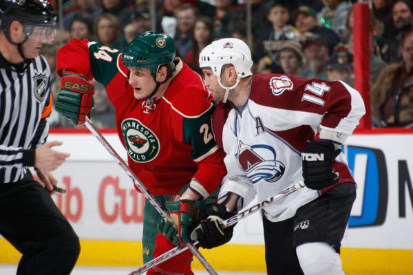 SAINT PAUL, MN - APRIL 9: During Game One of the Western Conference Quarter-Final of the Stanley Cup Playoffs Derek Boogaard #24 of the Minnesota Wild and Ian Laperriere #14 of the Colorado Avalanche fight for position at Xcel Energy Center on April 9, 2008 in Saint Paul, Minnesota. (Photo by Bruce Kluckhohn/Getty Images)